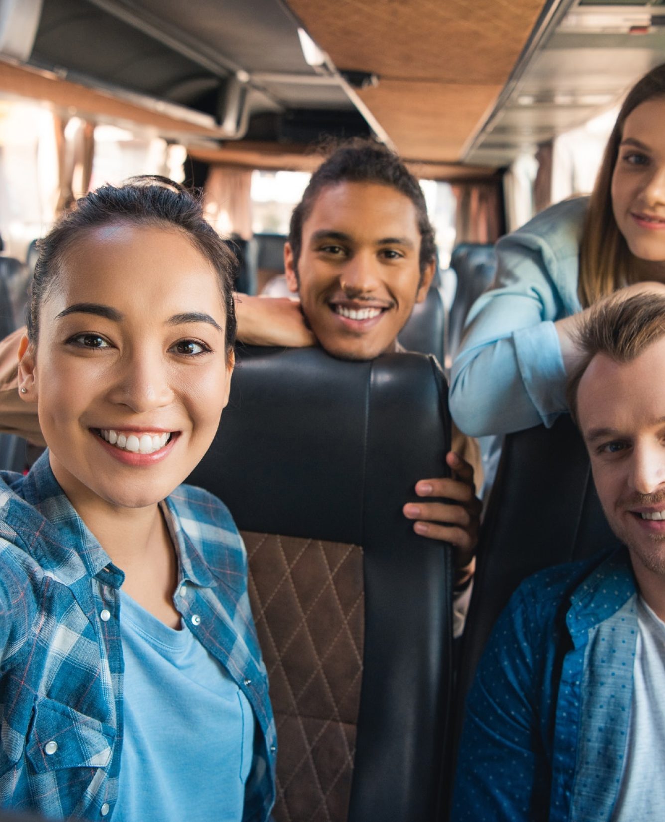 selective-focus-of-smiling-asian-woman-taking-selfie-with-multicultural-friends-in-travel-bus.jpg selective-focus-of-smiling-asian-woman-taking-selfie-with-multicultural-friends-in-travel-bus.jpg